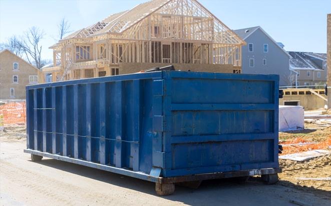 dumpster in driveway for renovation project